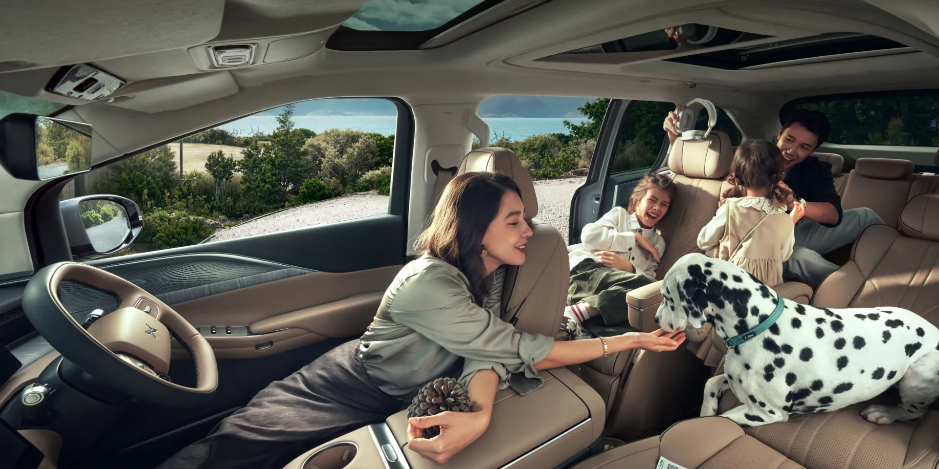 Family and dog together inside the XPENG X9